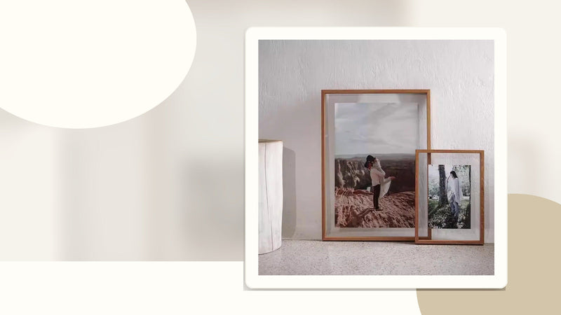 Transparent teak wood frames arranged for a small gallery wall display